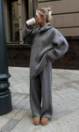 Woman wearing gray half zip sweater 2 piece set with wide leg pants outdoors