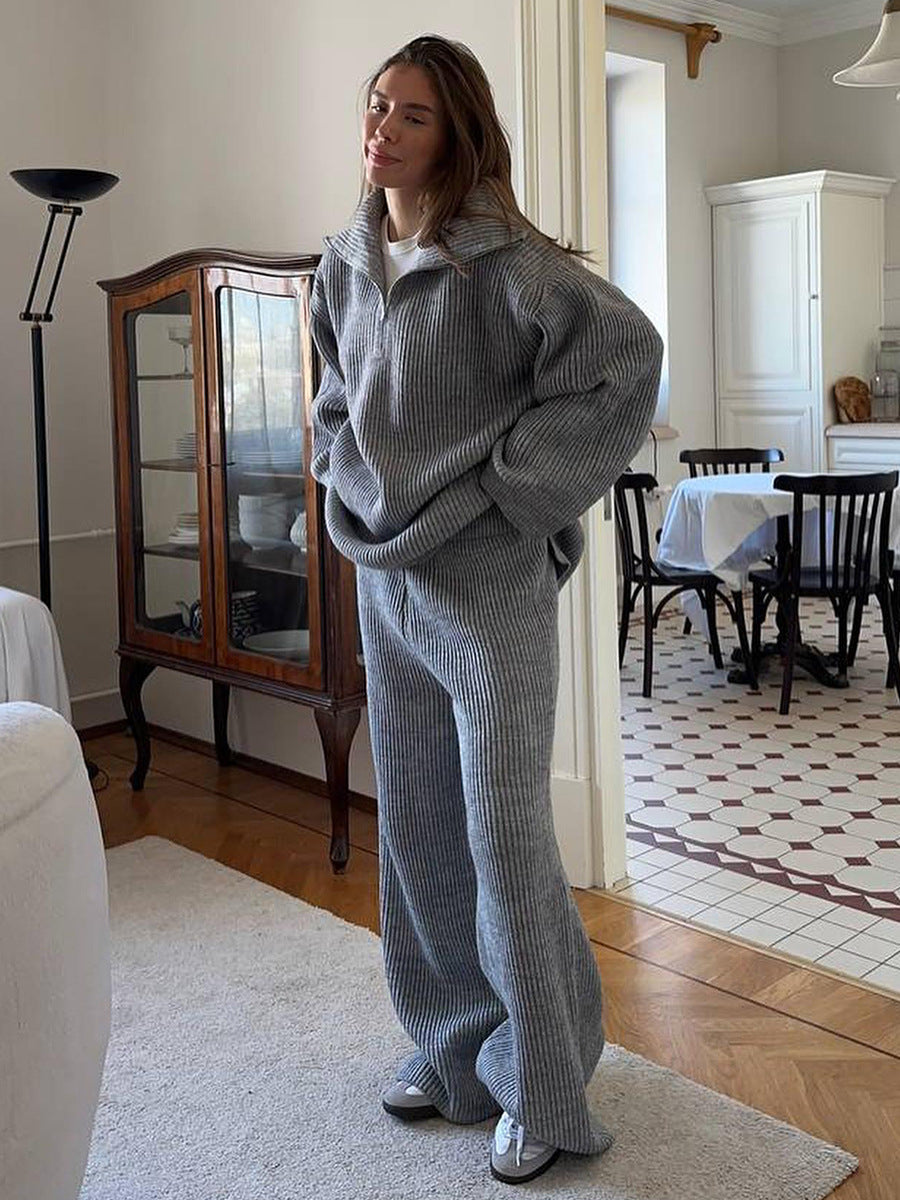 Gray knit 2 piece set with half zip sweater and wide leg pants in living room