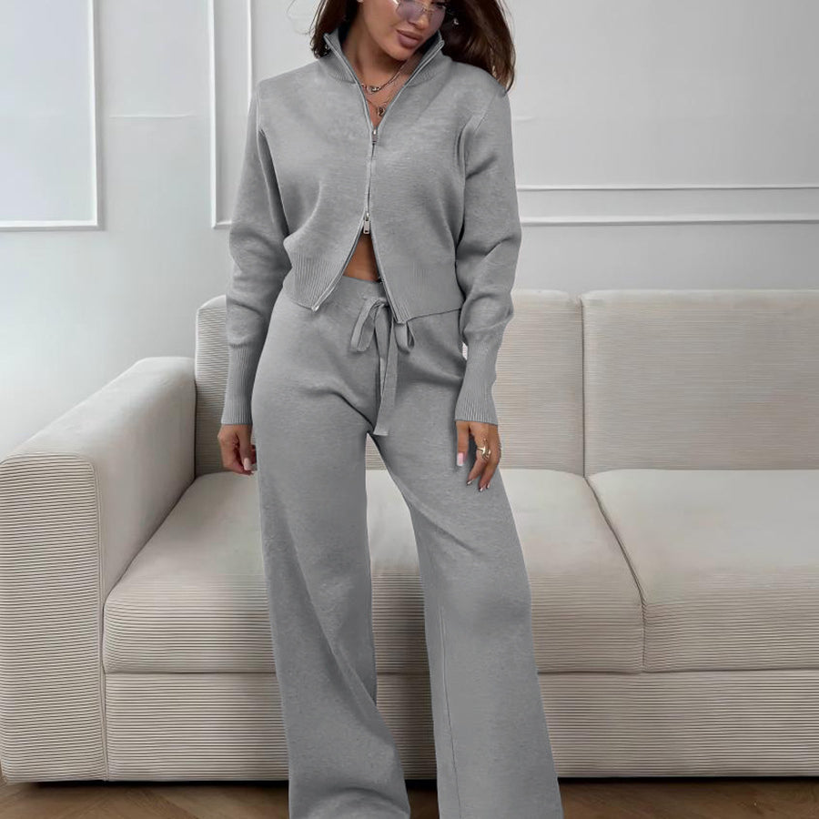 Woman wearing gray knit 2 piece set with zip jacket streetwear style
