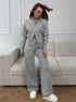Woman wearing gray knit 2 piece set with zip jacket streetwear style
