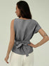Back view of gray sleeveless top with waist tie and wide shoulders

