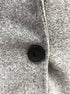 Close-up button—gray teddy coat, one-button placket detail