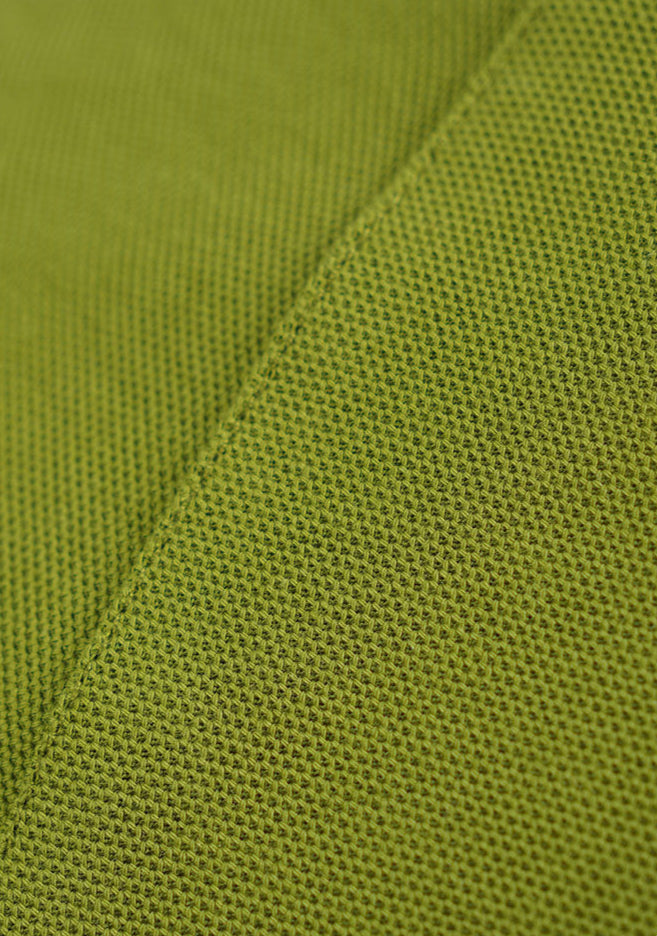 Close-up of green retro contrast long sleeve t-shirt fabric texture