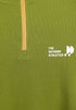 Close-up of green long sleeve t-shirt half-zip neckline with stitching detail