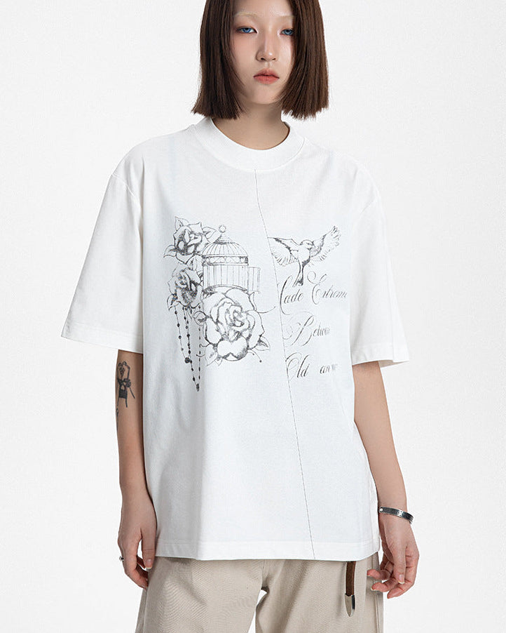 Front view of a model wearing a white cotton blend graphic t-shirt with delicate rose print.