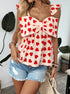Woman in heart print top with big bow and denim shorts