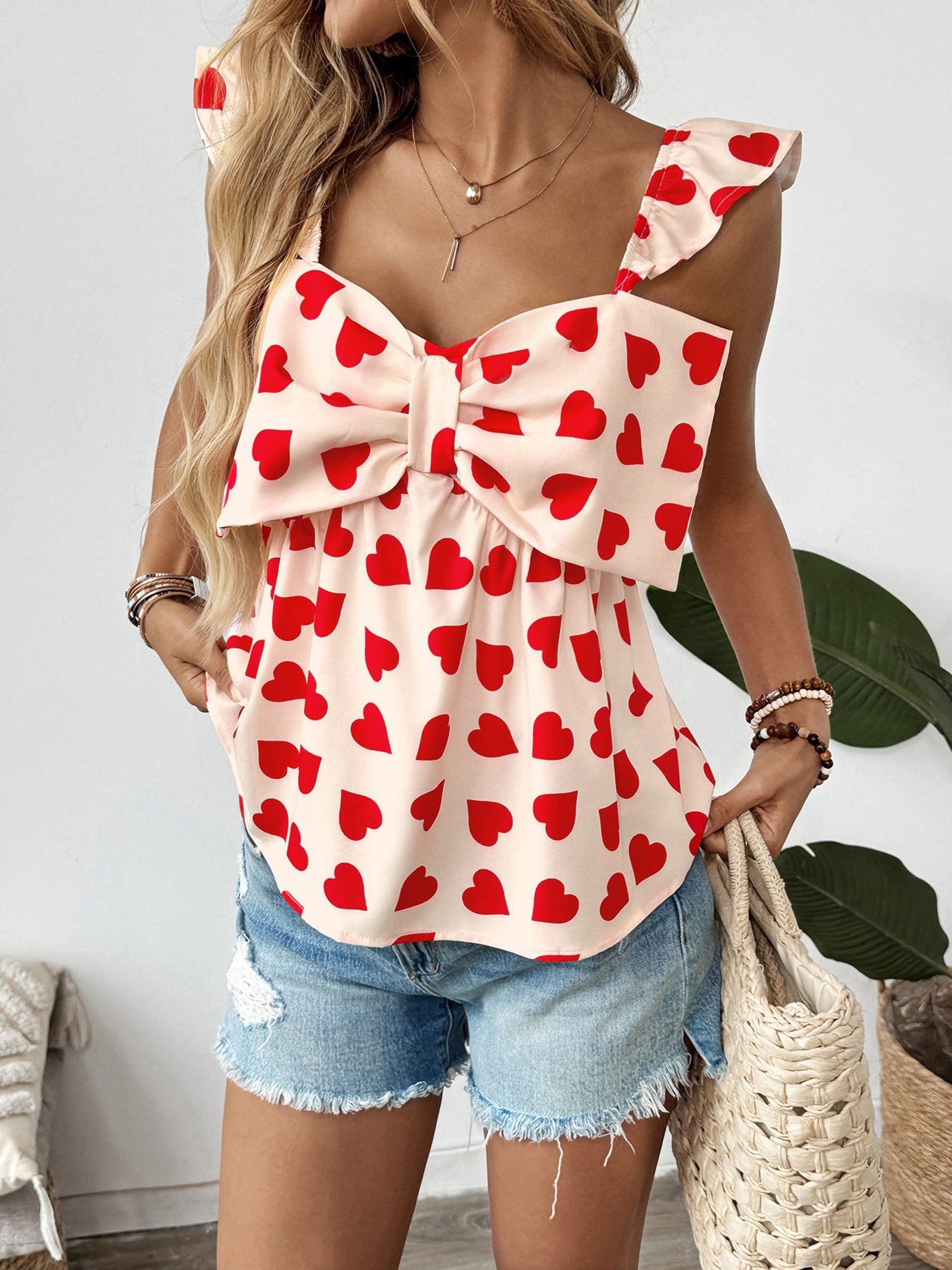 Red heart print blouse with large bow and pockets