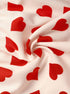 Close-up of red heart print fabric in soft swirl