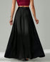angled back view of high-waist black long skirt showing flowy drape