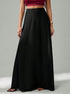side view of woman wearing high-waist black A-line long skirt
