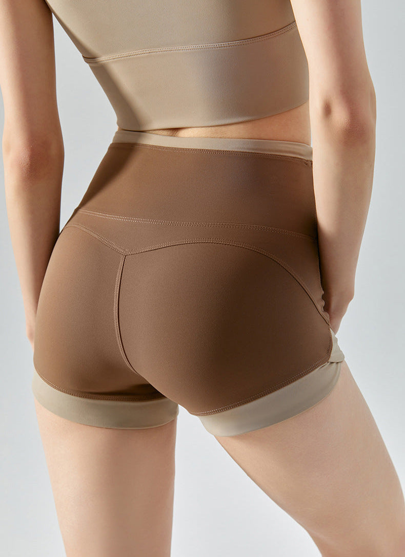 Back angle of brown shorts with contrasting beige waistband.