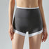 Gray high-rise workout shorts with white hem shown from front.