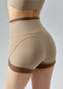 Detailed back view of khaki workout shorts with brown edges.
