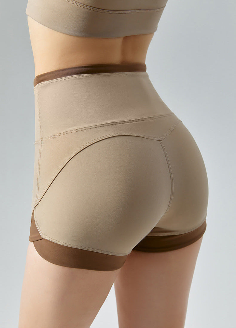 Detailed back view of khaki workout shorts with brown edges.