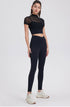 Black high waisted seamless workout leggings with sculpting fit.