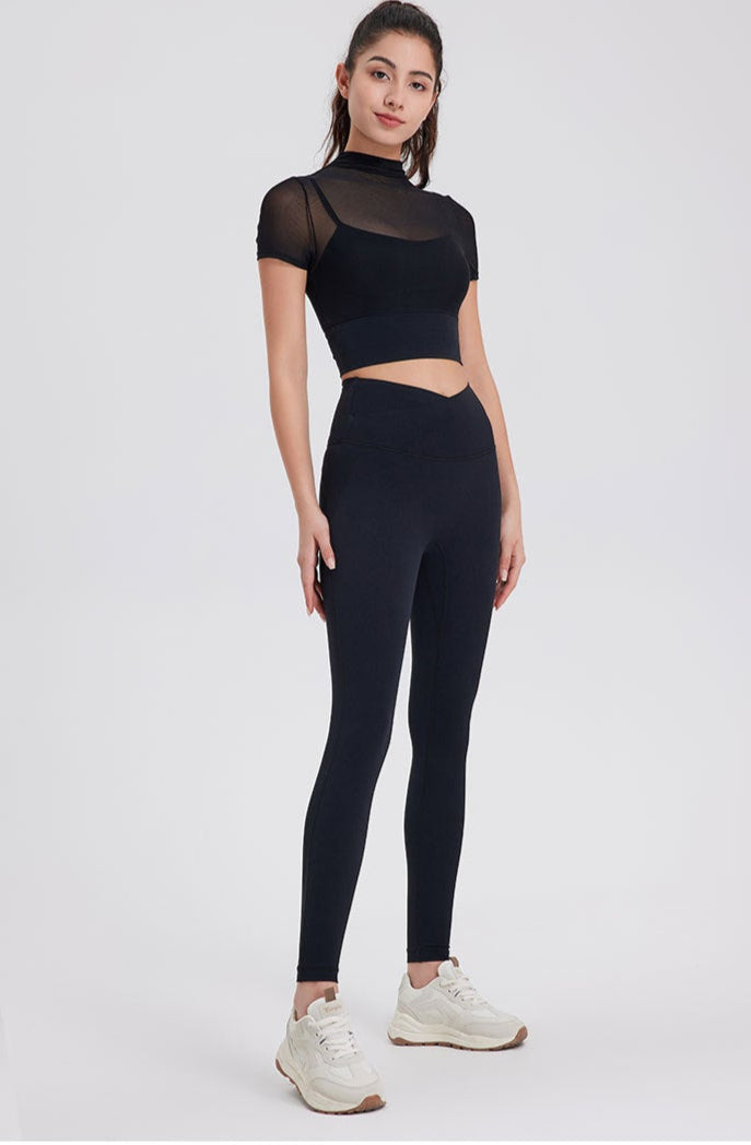 Black high waisted seamless workout leggings with sculpting fit.