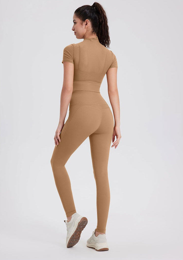 Camel brown seamless workout leggings with high waist and shaping seams.
