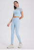Light blue high waisted seamless workout leggings with peach-lift design.