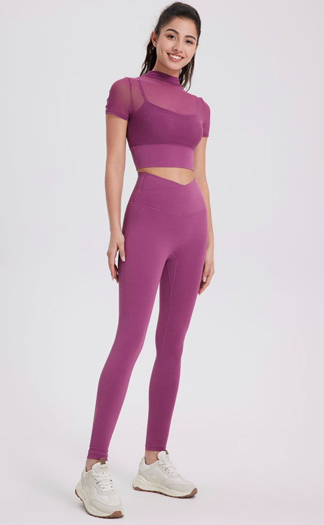Purple seamless workout leggings with peach-lift design and snug fit.