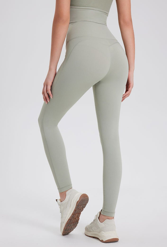Sage green high waisted seamless workout leggings with peach-lift design.