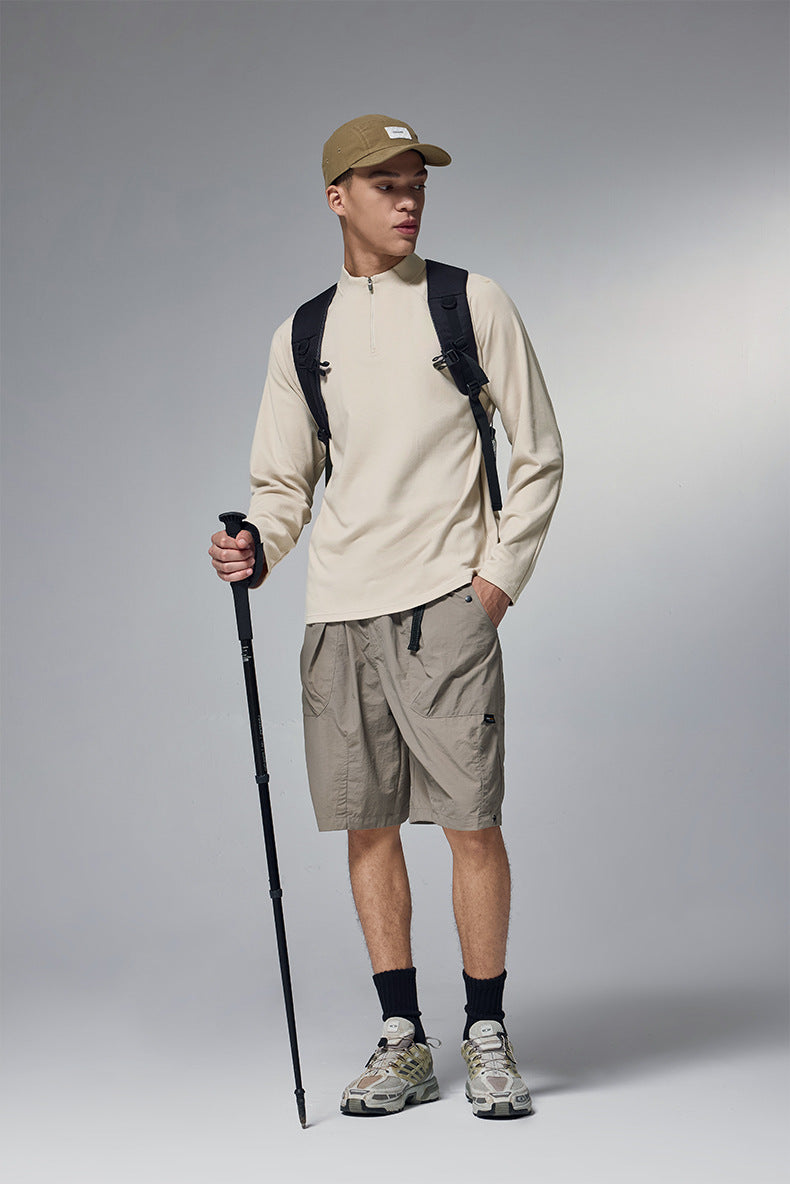 Mens khaki half zip long sleeve t shirt styled with beige pants