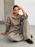 Woman in khaki half zip sweater 2 piece set with wide leg pants