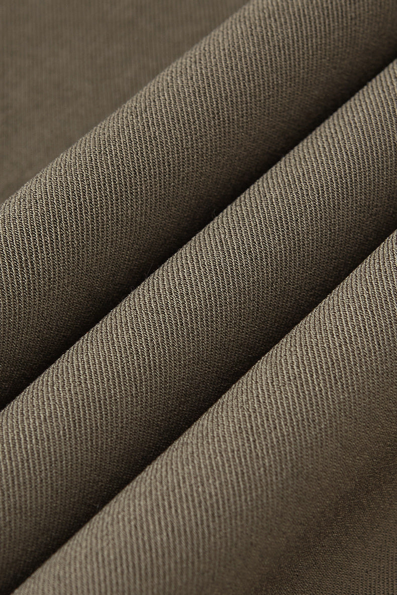 Close-up texture of khaki mens dress pants fabric with fine weave