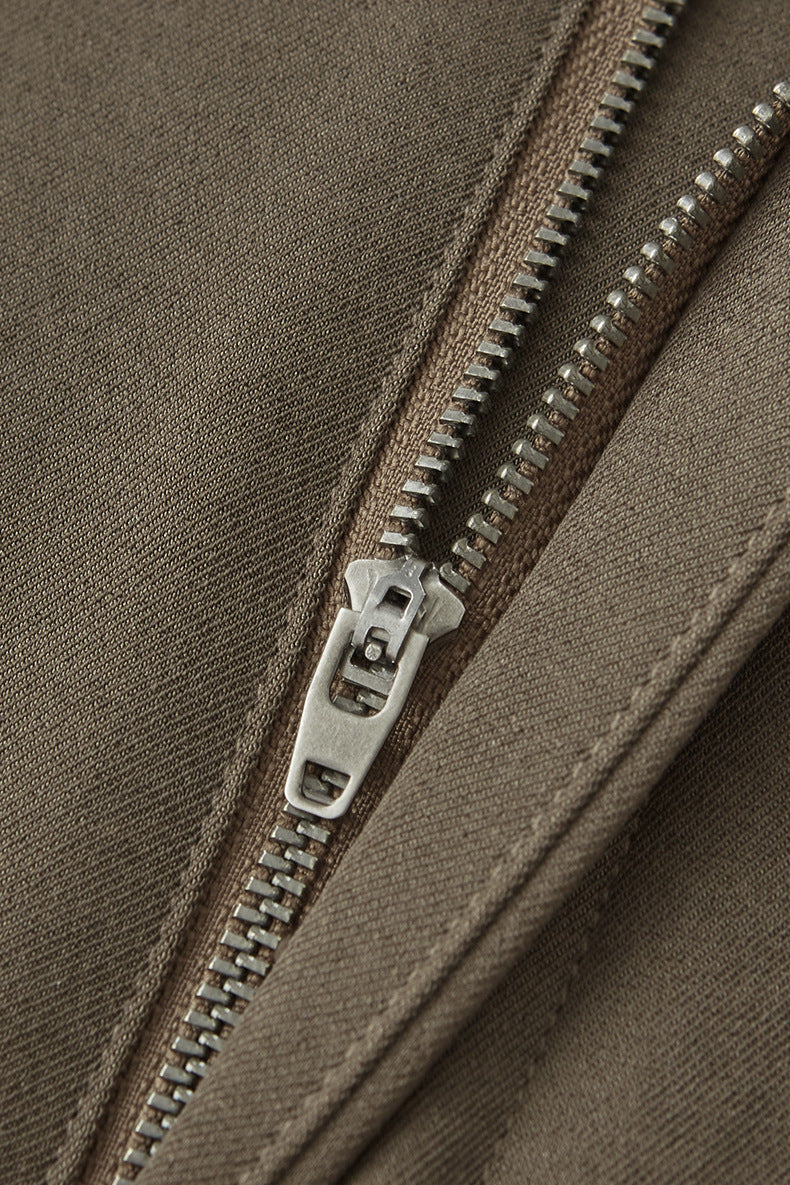 Close-up of khaki mens dress pants zipper and stitching detail