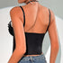 Woman wearing a black lace corset top and blue jeans, shown from the back.