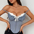 Light blue corset with white lace bust and front hooks, styled with black jeans.