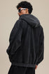 Back view of black zip hoodie with oversized hood and rib hem