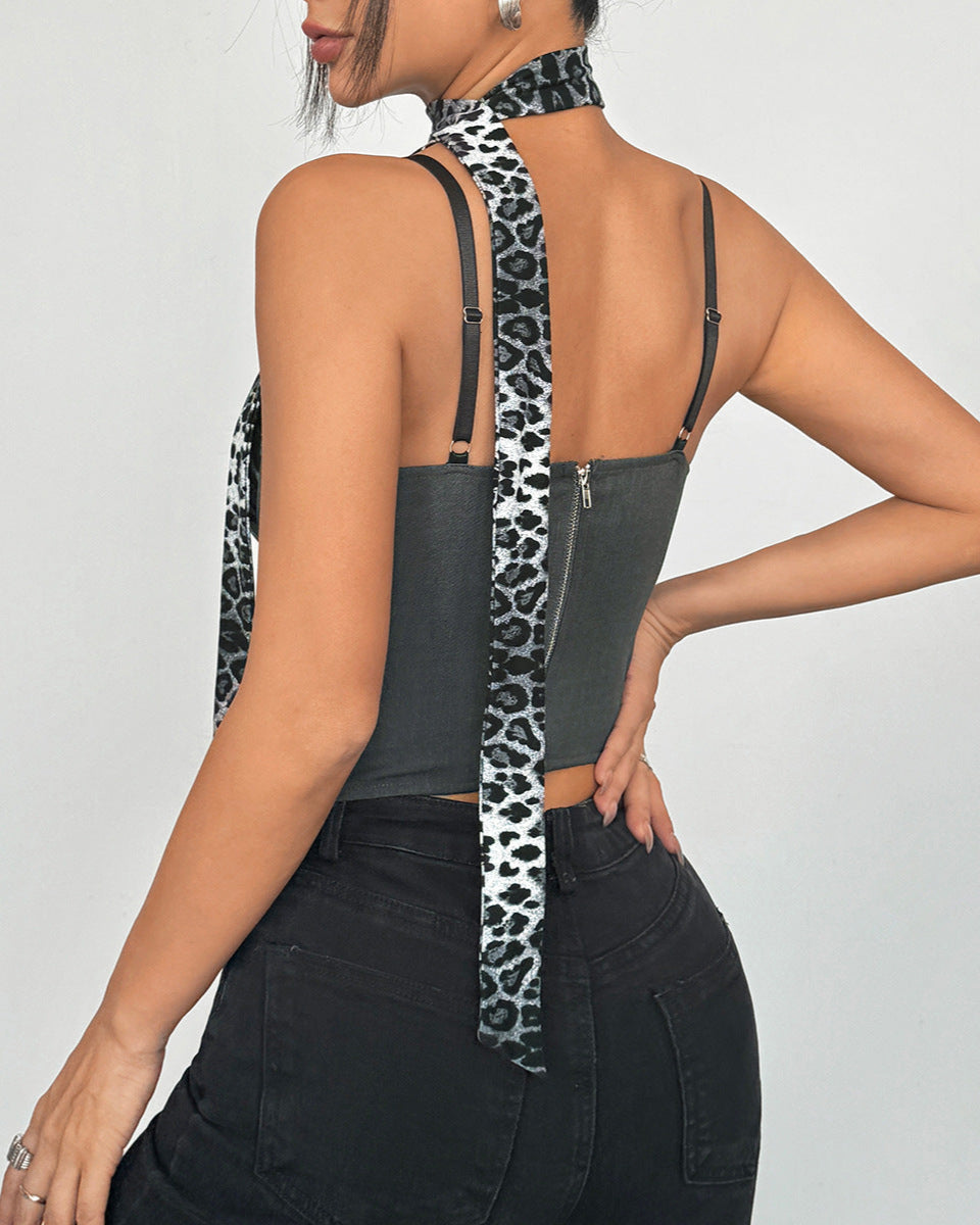 Back of gray corset showing zip and extended leopard tie.