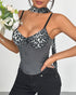 Model holds flowers while wearing gray corset top with black leopard cups.