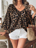 Leopard print V neck blouse paired with white shorts casual look
