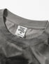 Close-up of neckline and tag on gray “Liberalism” graphic tee.