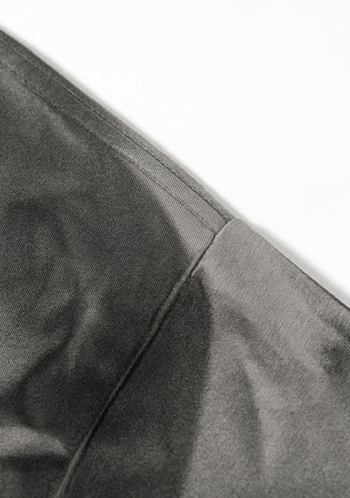 Close-up of inner seam stitching on gray “Liberalism” tee.