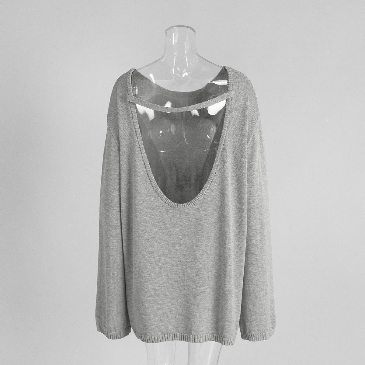 Back view of light gray  backless knit sweater with open scoop back