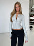 Light gray knit cardigan sweater front view with buttons