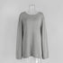 Front view of light gray knit sweater with long sleeves
