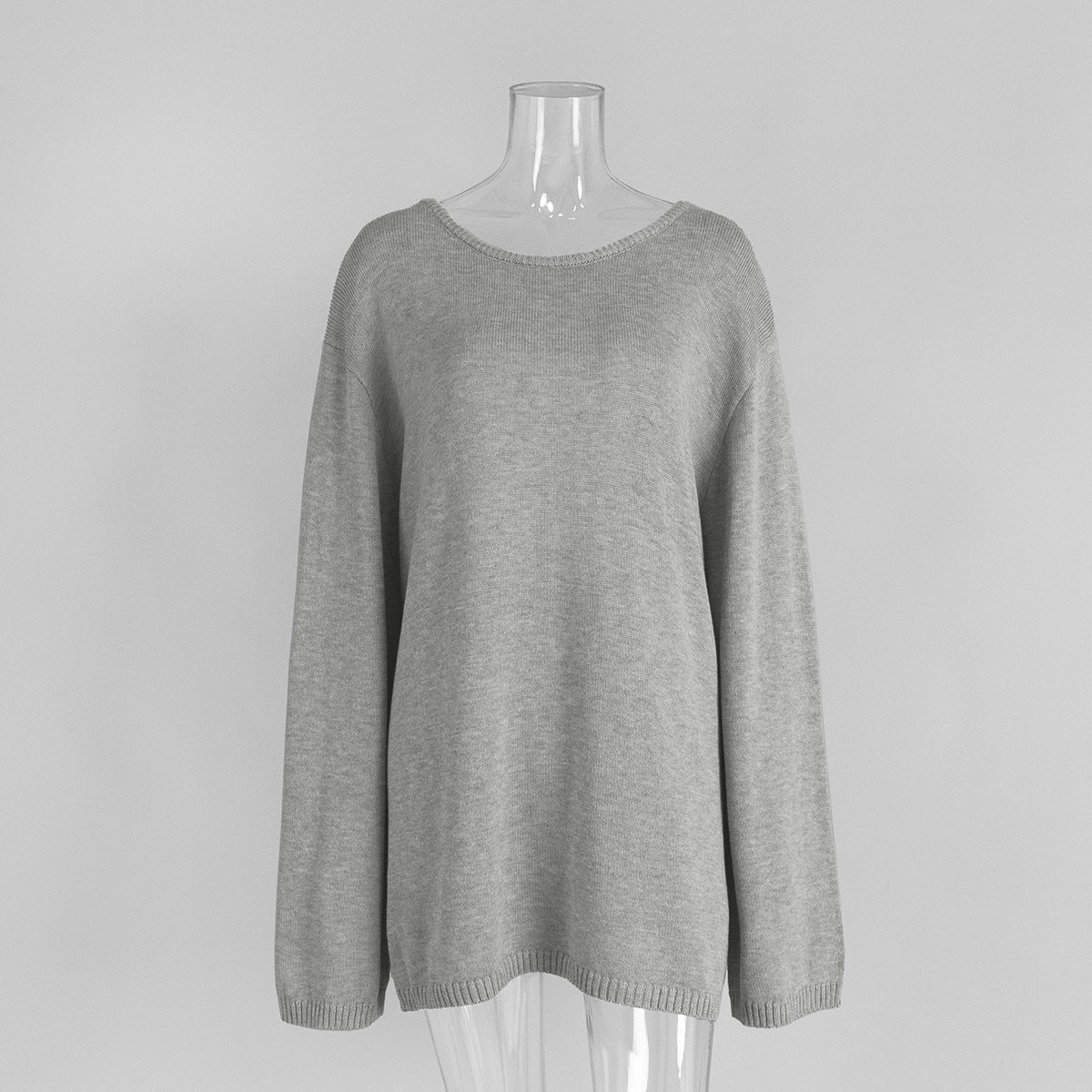 Front view of light gray knit sweater with long sleeves