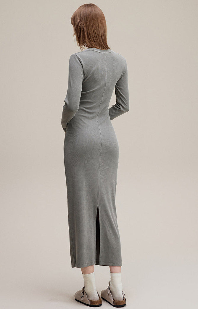 Light gray long sleeve bodycon dress, back view with side slit at hem