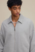 Light gray polo zip up, lapel collar and zipper detail