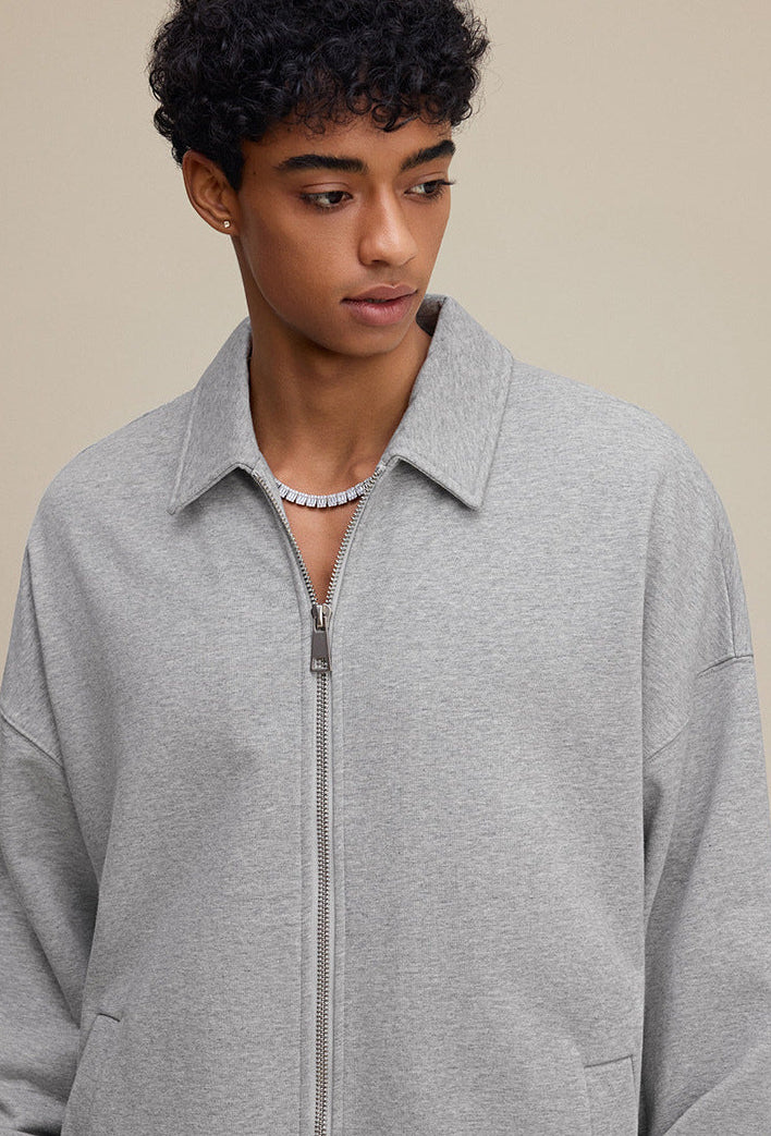 Light gray polo zip up, lapel collar and zipper detail
