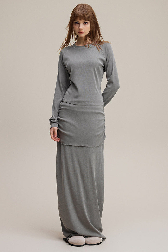 Model wearing light gray slim fit women’s long sleeve tee