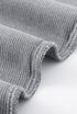 Edge stitching close-up of light gray ribbed long sleeve tee fabric