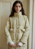 Pocket and sleeve detail of light green long puffer coat for women