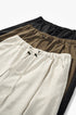 Linen wide-leg trousers in beige, khaki, and black stacked together