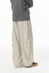 Linen wide-leg trousers in light beige, loose fit with back pleat details