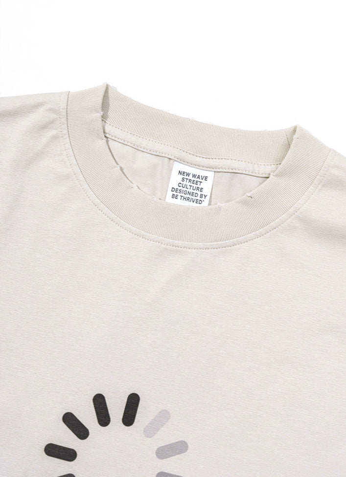 Close-up of ribbed neckline and label inside cream t-shirt.