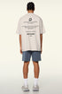 Back of cream loading tee featuring motivational quotes in black text.